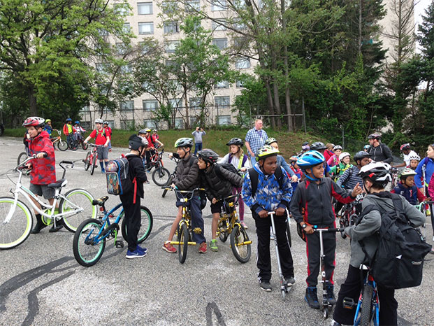 Photo of elementary school aged students participating in Bike to School Day 2016 in Takoma Park